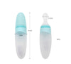Een groene siliconen lepel met de afmetingen. De lengte van de lepel is 21 cm, de breedte is 5 cm. De breedte van het lepelgedeelte is 2,5 cm en er kan een inhoud van 90ml in de lepel.